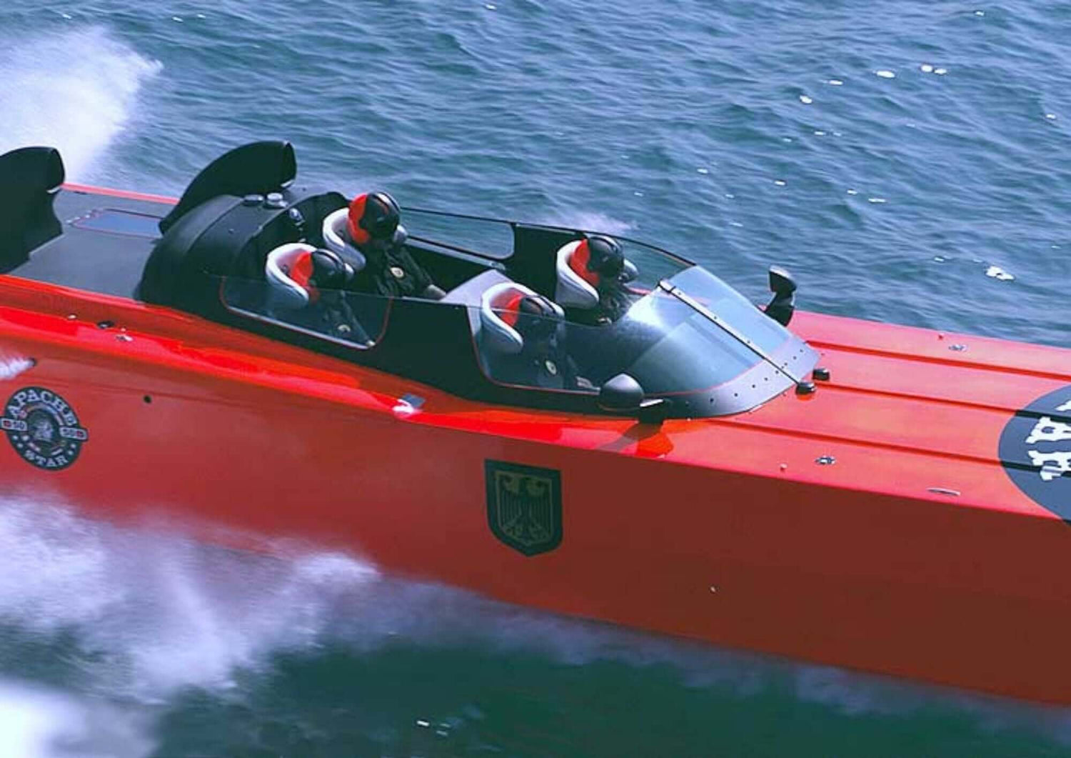 High-speed APACHE STAR powerboat racing across ocean waters