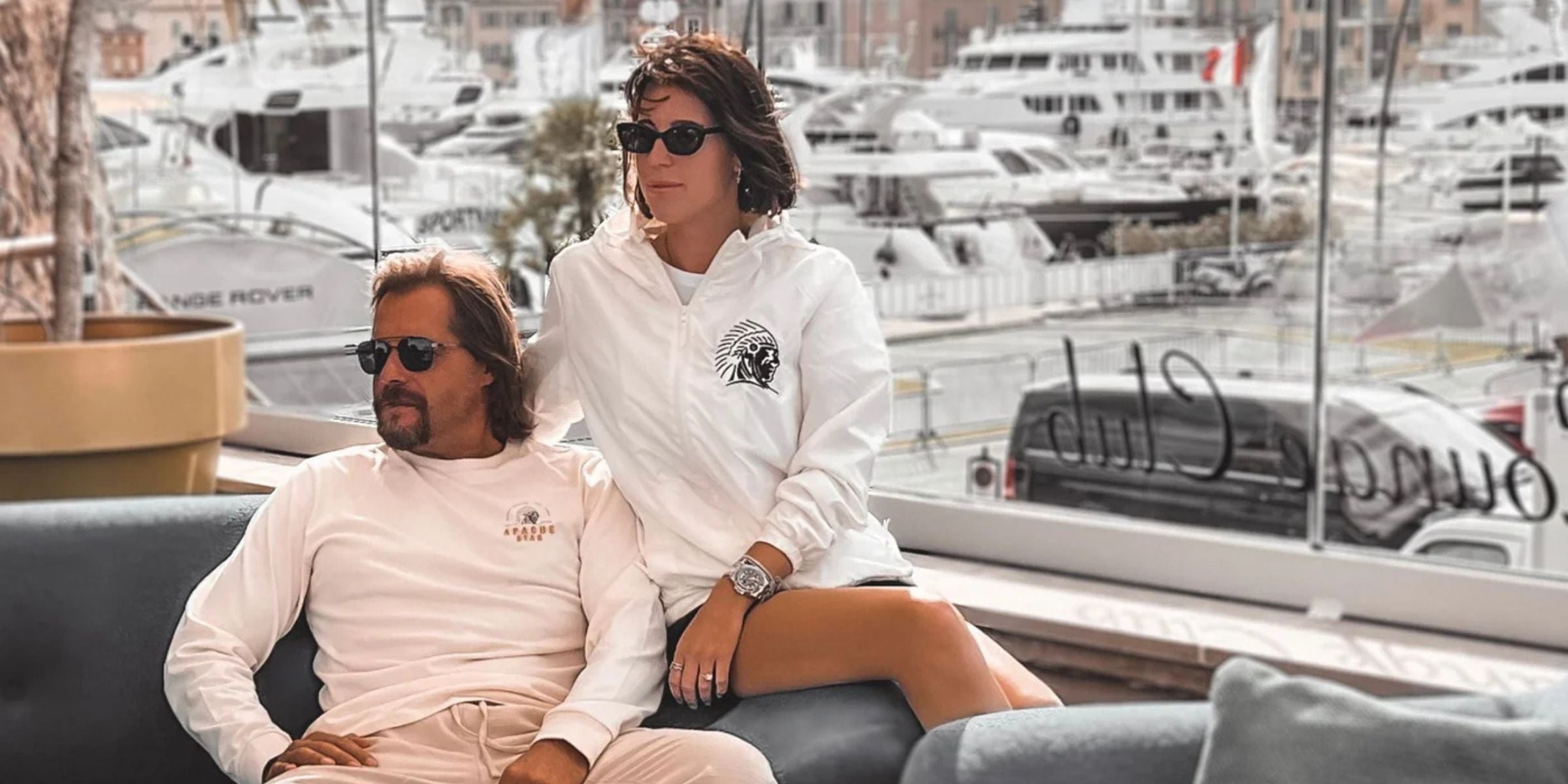 Race boat driver Roger Klüh and his fiancee Jessica Frühbrodt wear APACHE STAR fashion near yachts at the YACHT CLUB in St. Tropez.