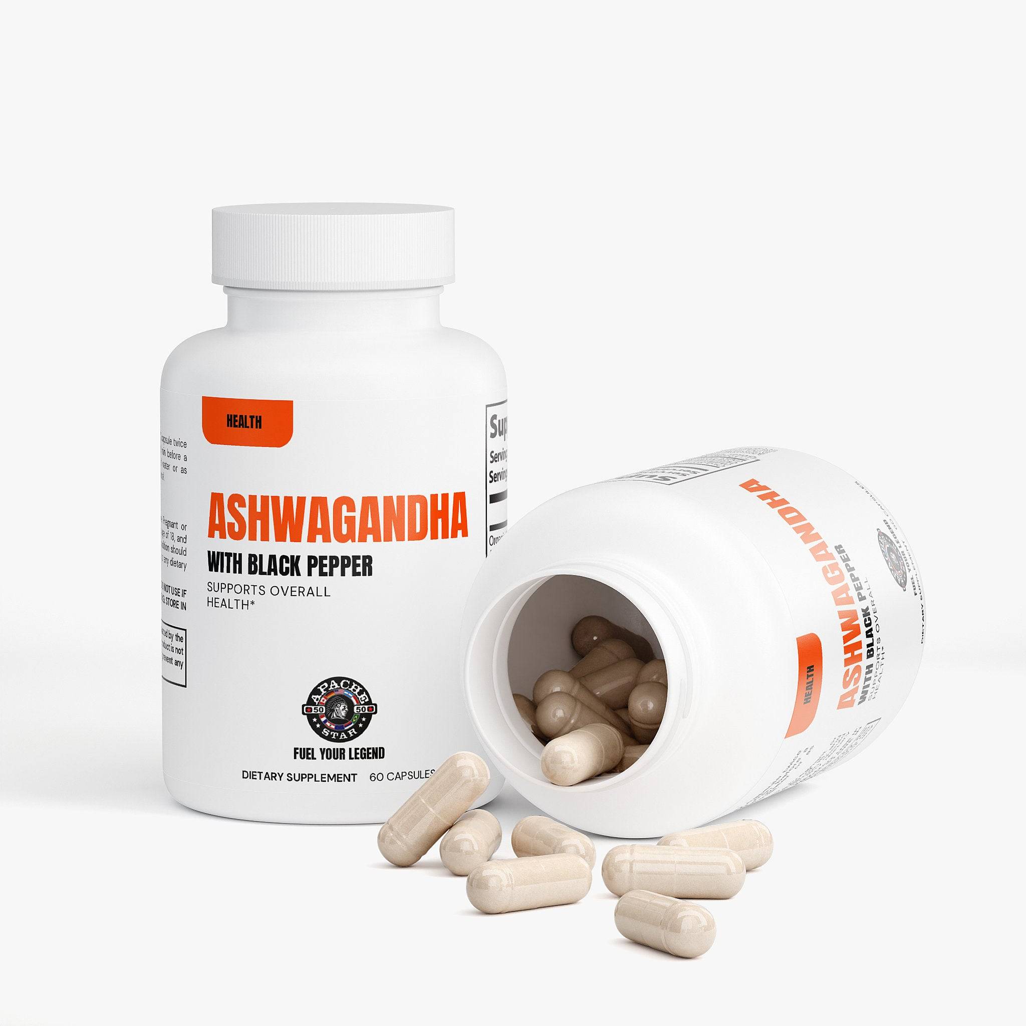 Capsules spilling from a white supplement bottle on a white surface