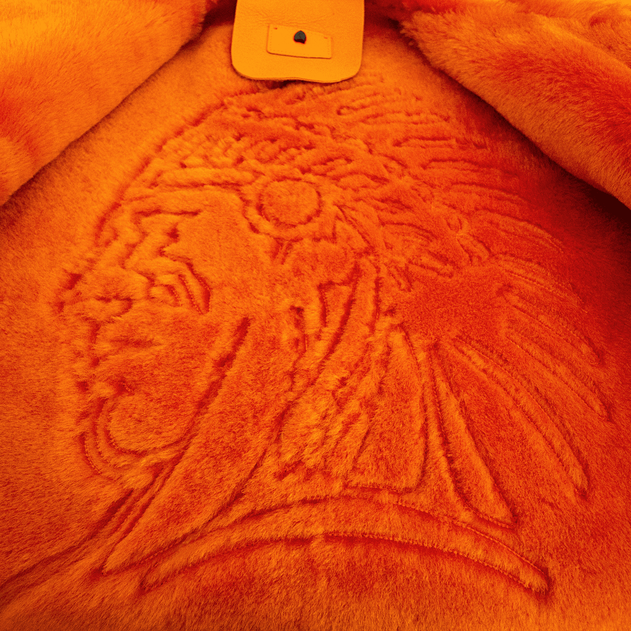 Embossed Native American chief design on inner back of FLAMING AVIATOR by APACHE STAR Toscana Nappa Lamb Pilot Jacket. Signature detail in bold orange shearling.