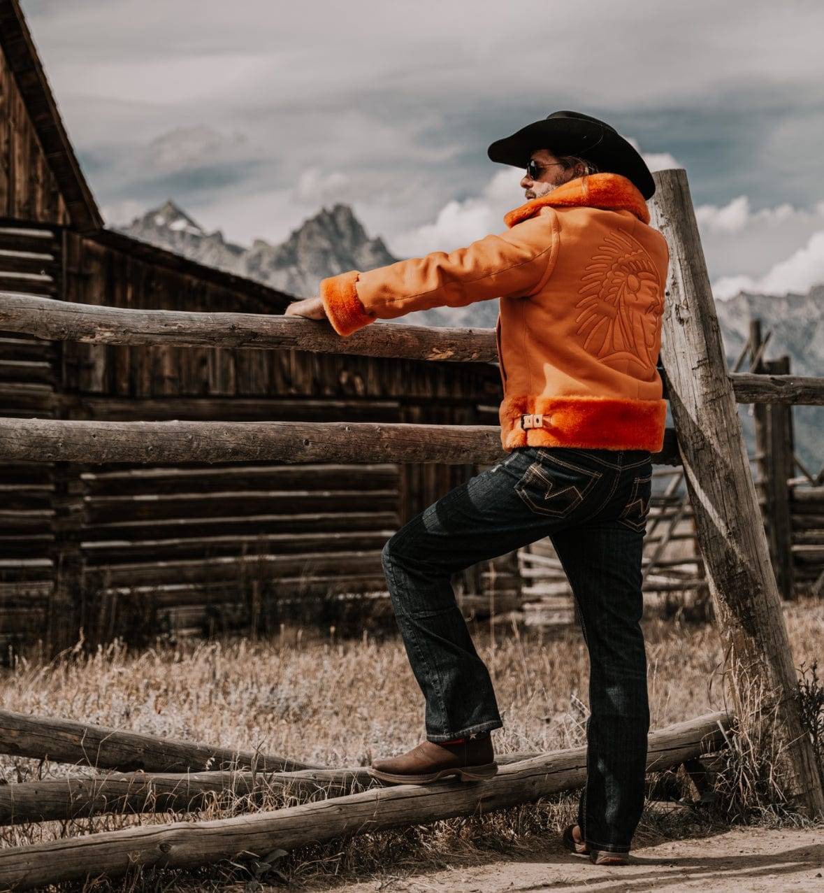 Roger Klüh with cowboy hat wearing FLAMING AVIATOR by APACHE STAR Toscana Nappa Lamb Pilot Jacket outdoors. Rugged luxury outerwear for bold explorers and adventurers.