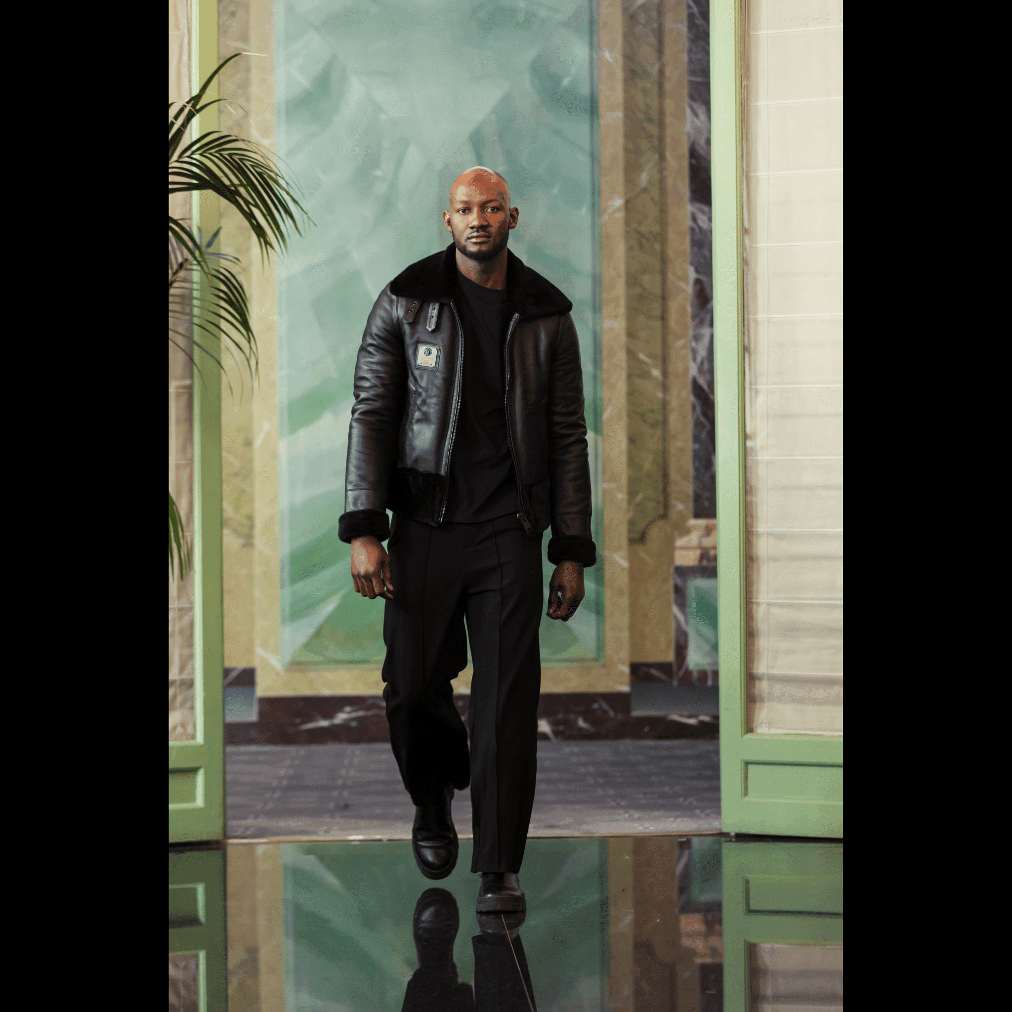 Model wearing NAPPA LAMB PILOT JACKET „PHANTOM FALCON“ by APACHE STAR on runway, showcasing luxury outerwear at Paris Fashion Week 2025.