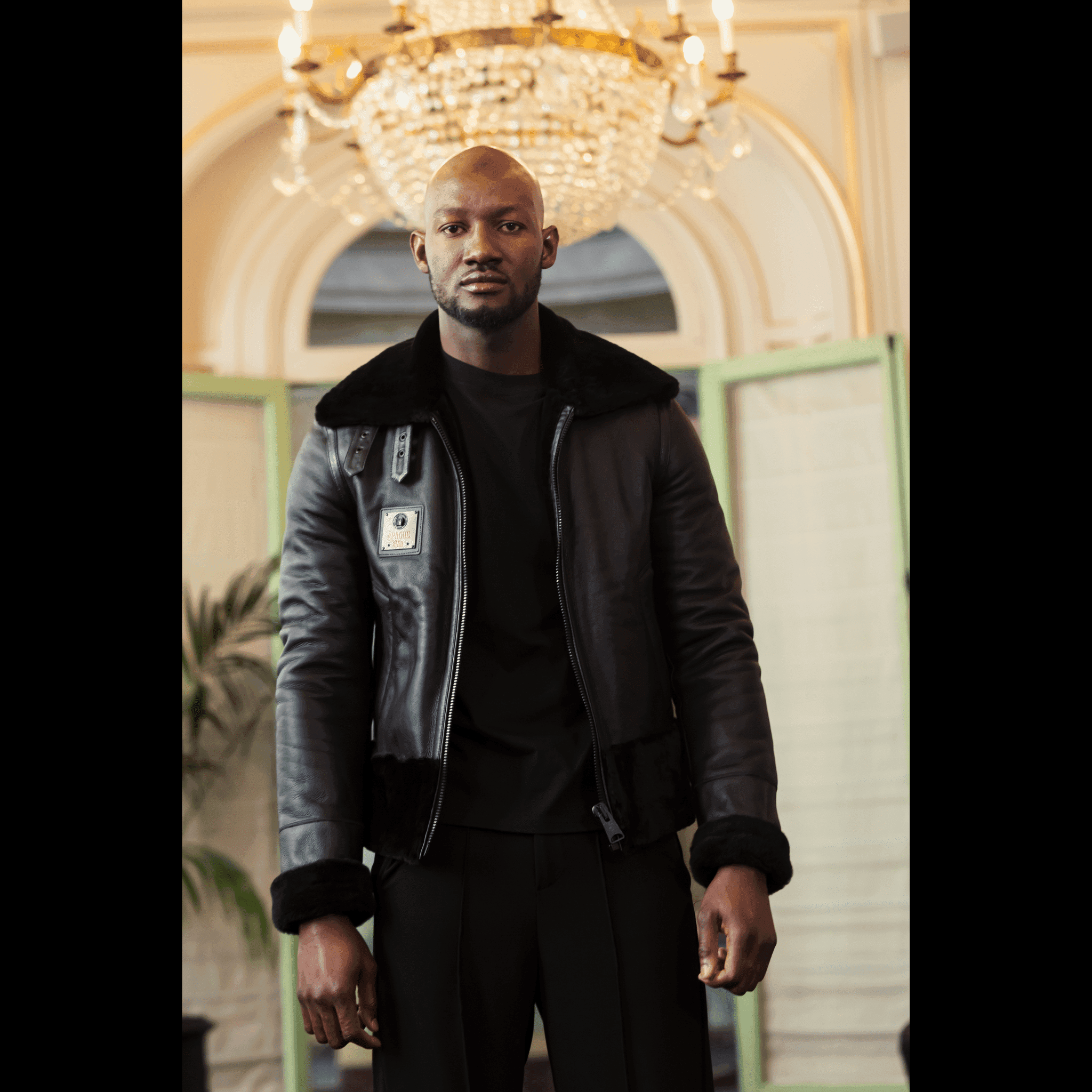 Close-up of model in PHANTOM FALCON Nappa Lamb Pilot Jacket by APACHE STAR at Paris Fashion Week 2025, highlighting premium leather and tailored fit.