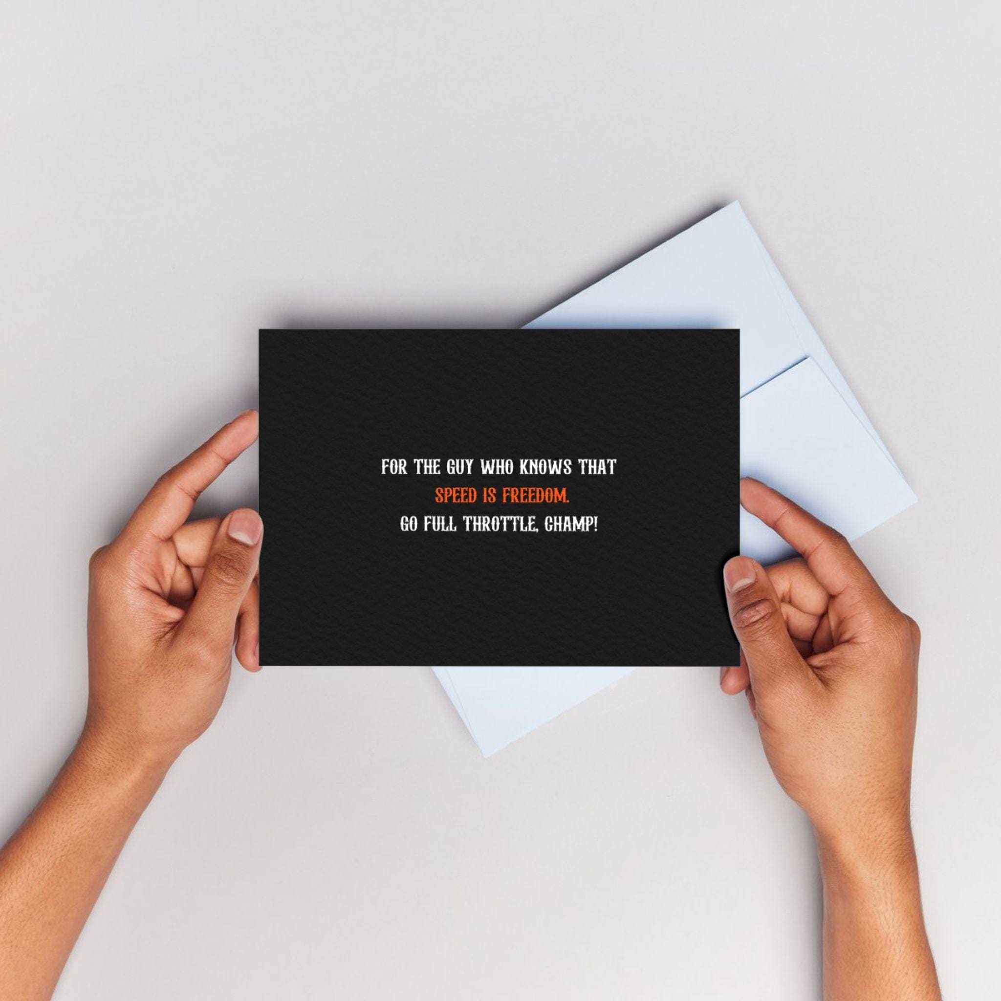 APACHE STAR Gift Card - Speed is Freedom held by hands over a light surface. Ideal for gifting fashion & lifestyle kits to speed enthusiasts.