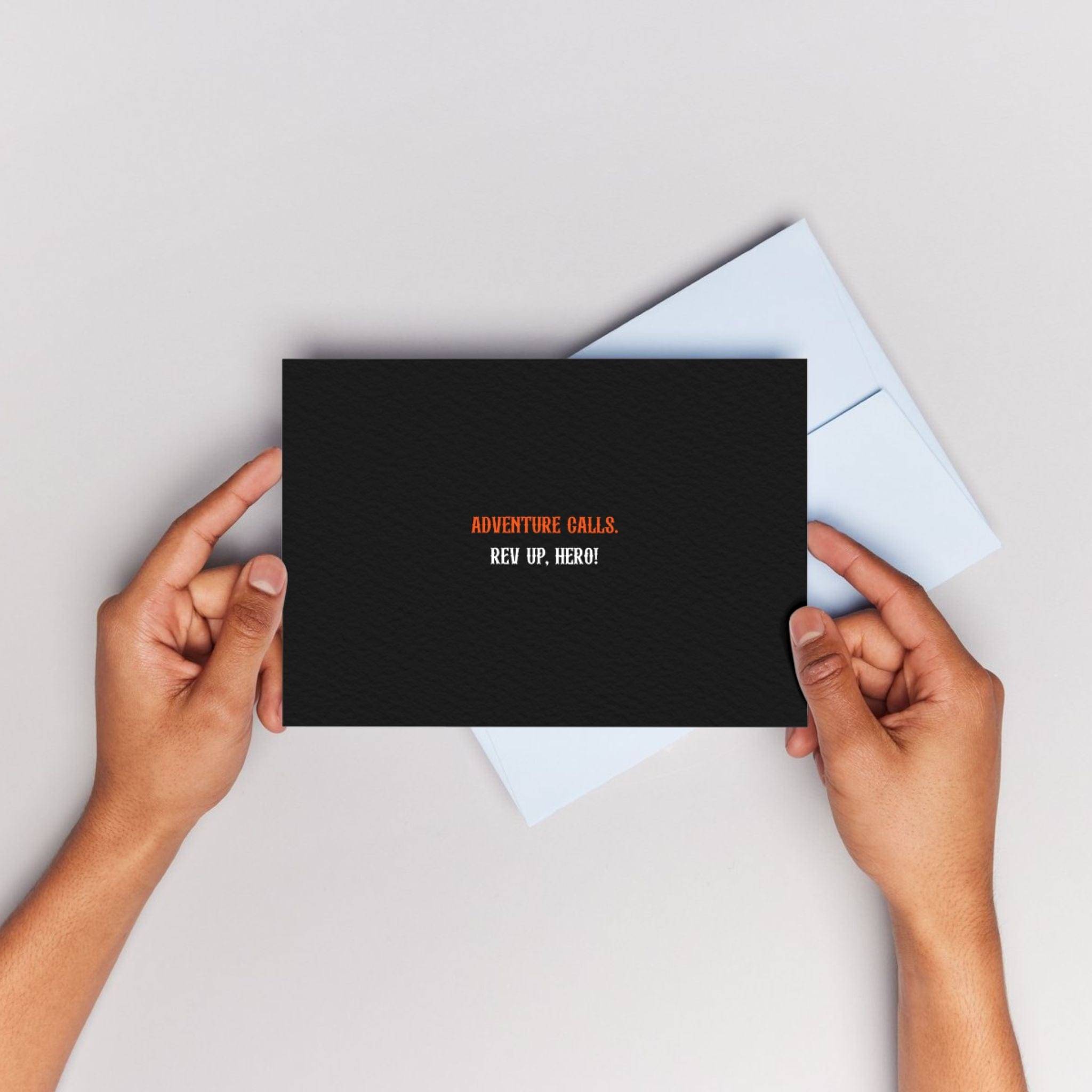 Hands holding APACHE STAR Gift Card Adventure Calls with bold text 'Adventure Calls. Rev Up, Hero!' on black textured card.