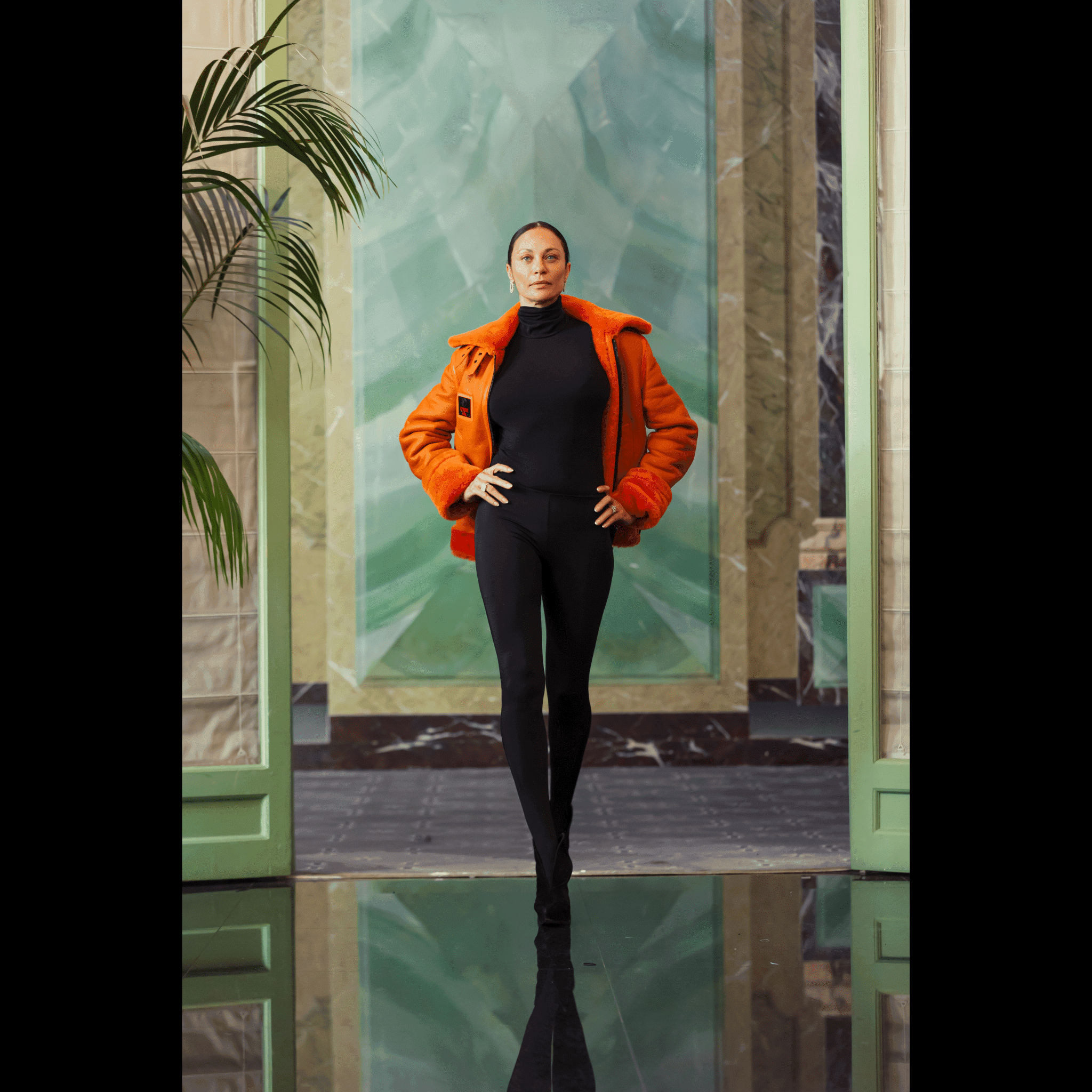 Lilly Becker wearing FLAMING AVIATOR by APACHE STAR Toscana Nappa Lamb Pilot Jacket in Apache Orange at Paris Fashion Week. Bold outerwear for high-end fashion lovers.