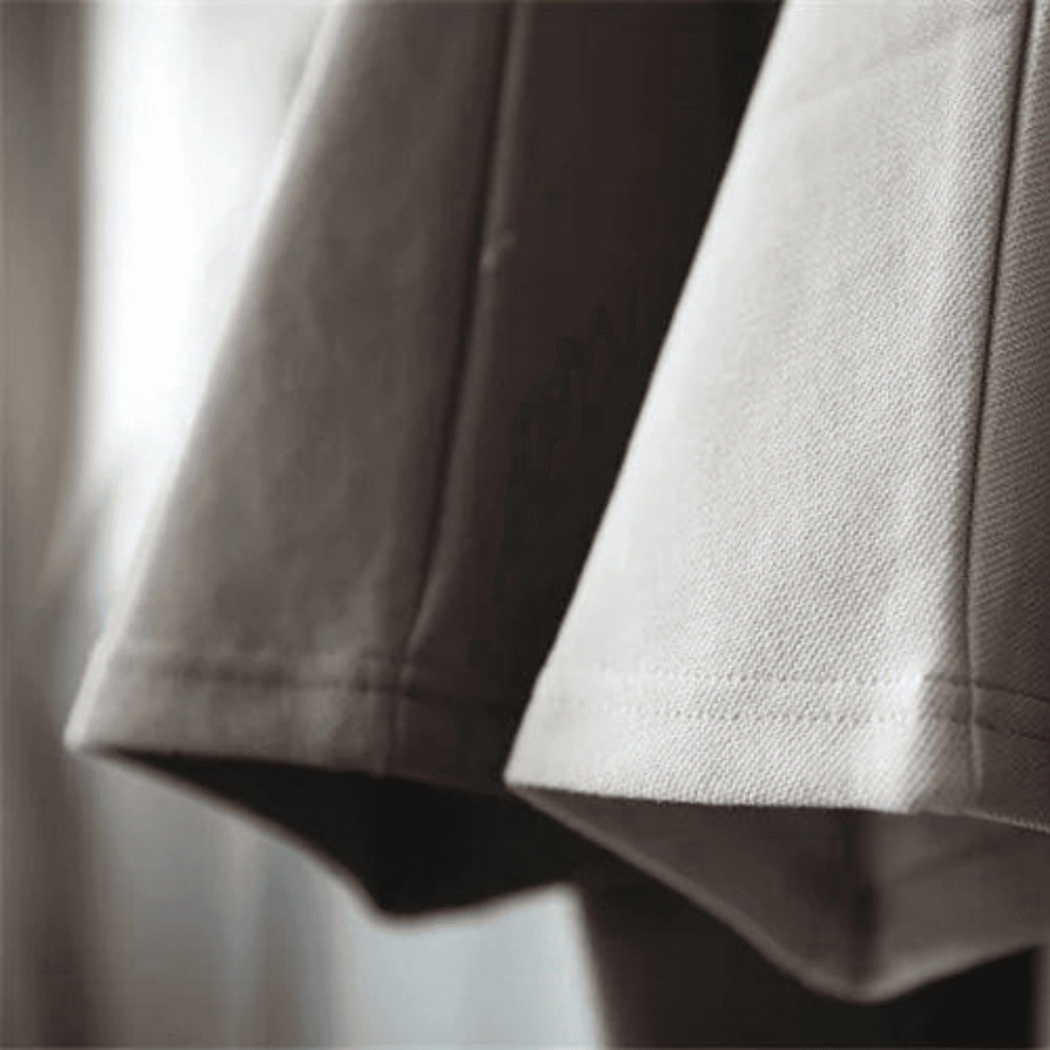 Detailed fabric view of BOXY TEE 'MANHATTAN' by APACHE STAR in beige and brown, emphasizing breathable, textured cotton material.