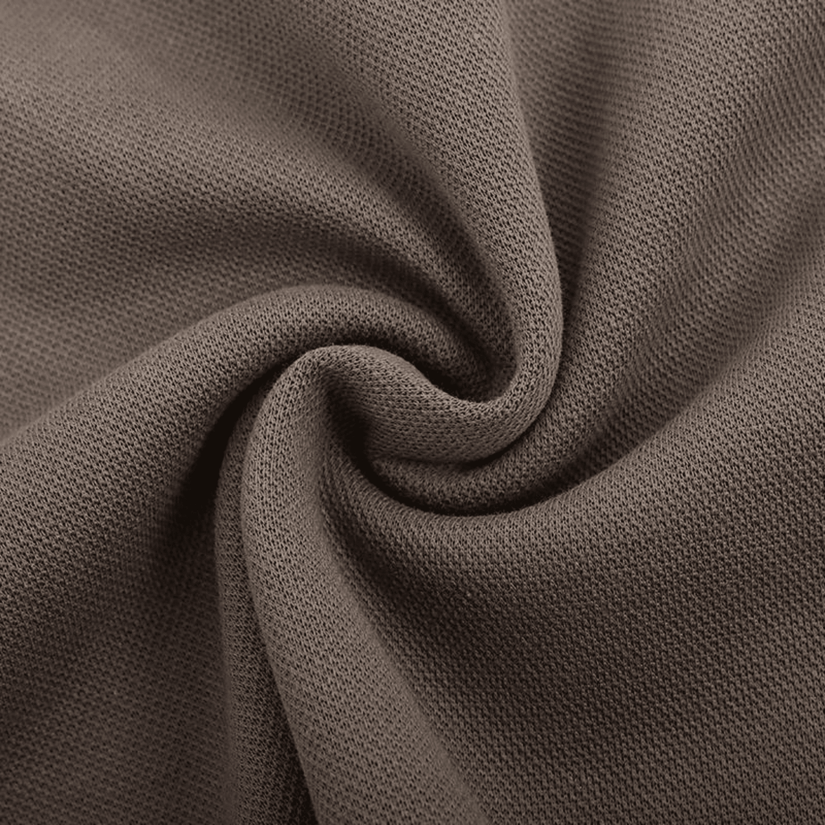 Brown textured fabric with intricate weave pattern