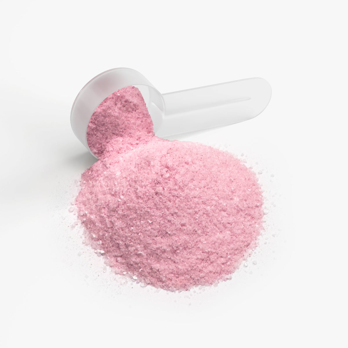 Dosing scoop filled with pink fruit punch energy powder next to a loose powder pile
