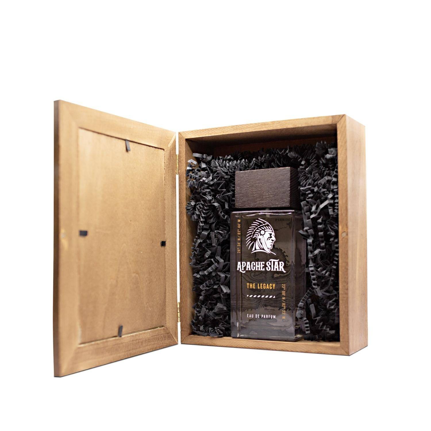 APACHE STAR® The Legacy Eau de Parfum 100ml nestled in black shredded paper inside a wooden gift box, ideal for gifting premium men's fragrance.