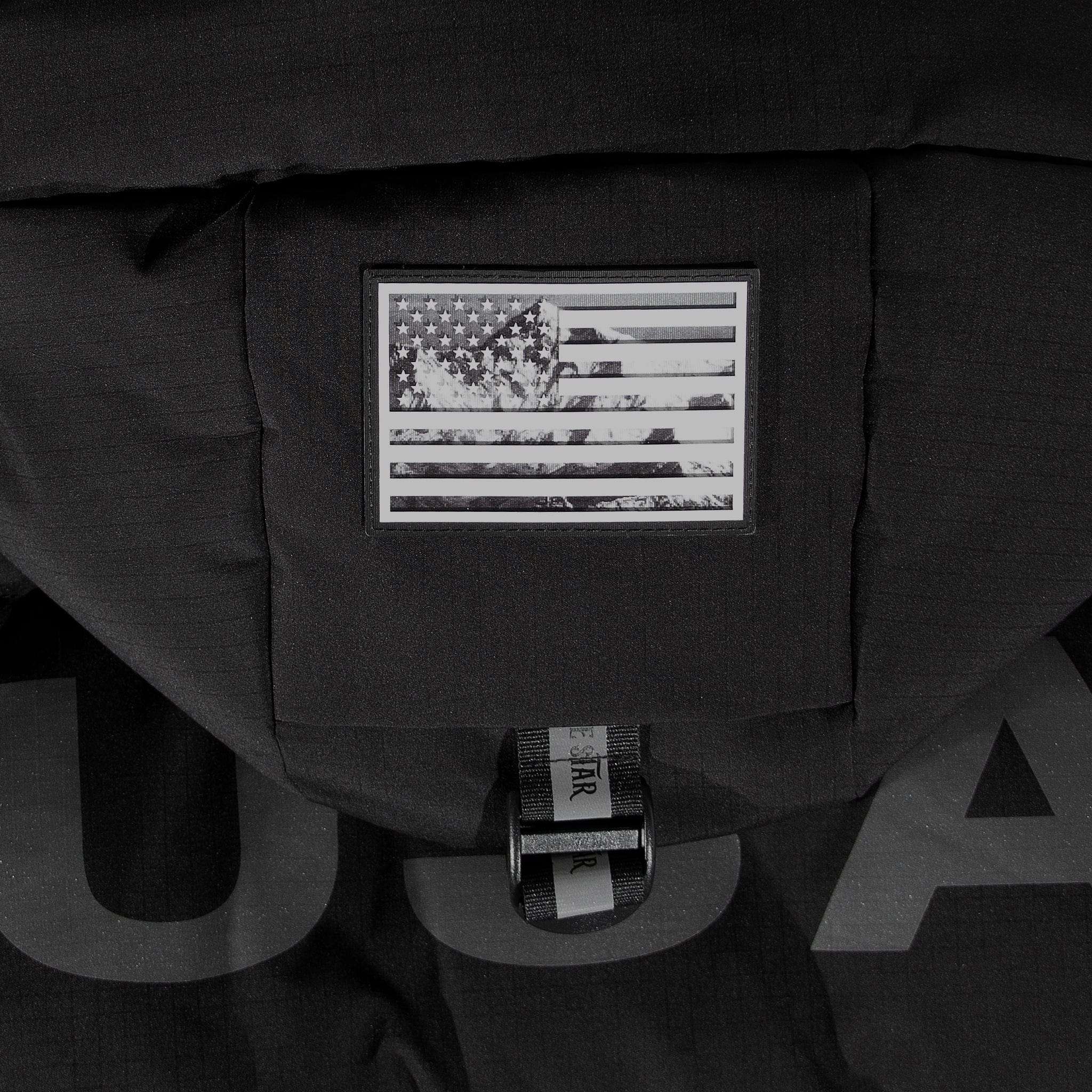 Detailed view of black and white American flag patch on hood of American Anchorage down jacket, emphasizing USA-inspired design by APACHE STAR.