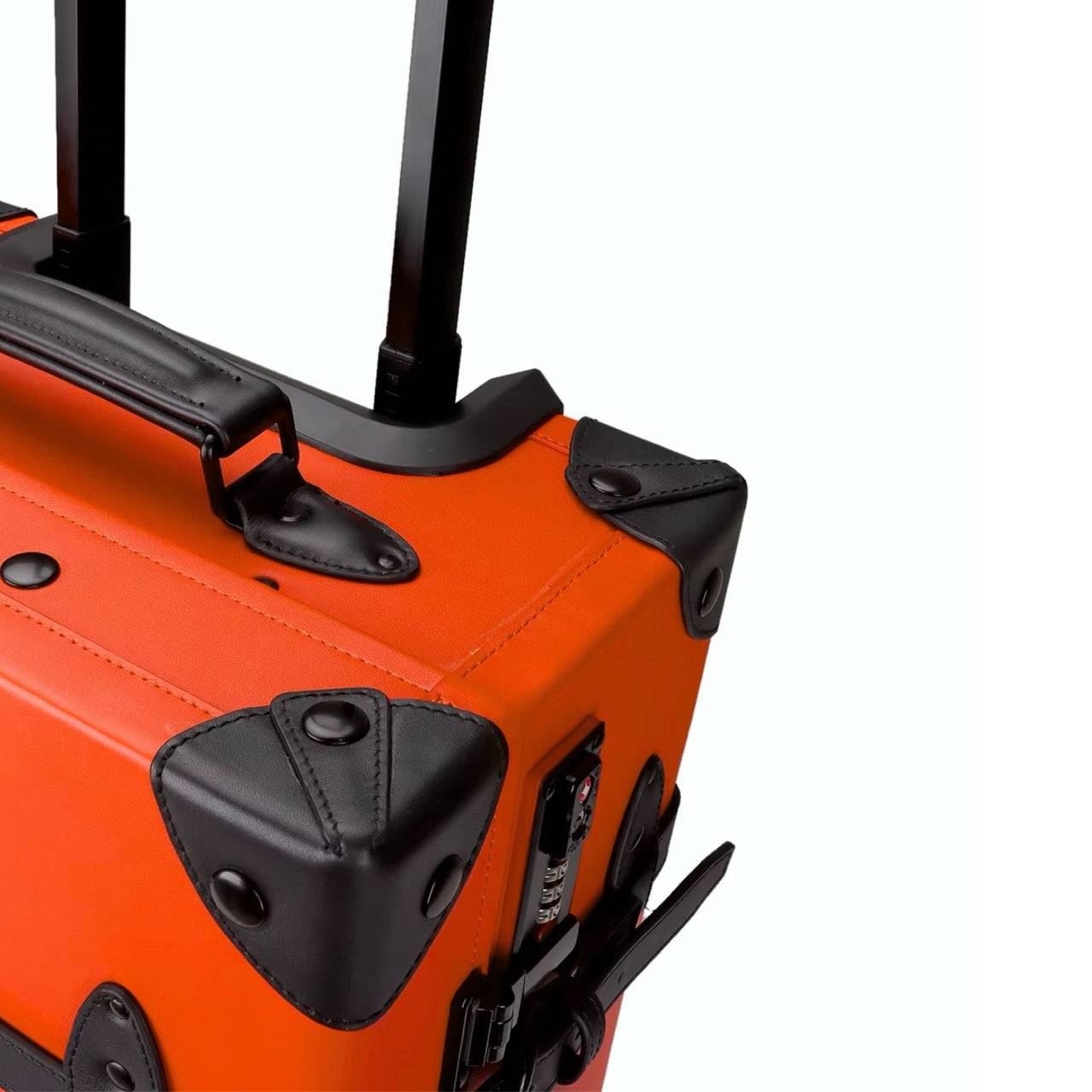 Top corner detail of APACHE STAR® Signature Orange suitcase with black leather trim and telescopic handle for premium travel functionality.