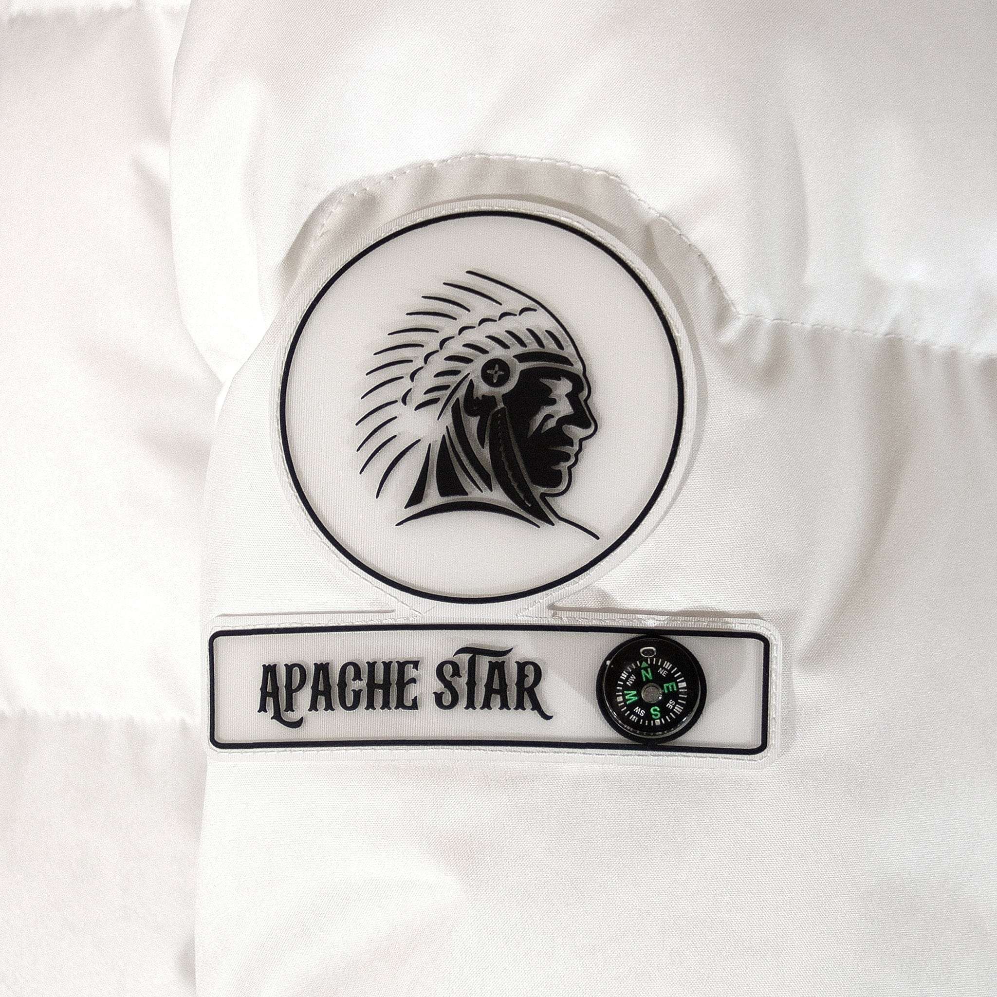 Close-up of APACHE STAR logo patch with compass on the sleeve of the Trident Trooper Down Coat, emphasizing brand identity and detail.