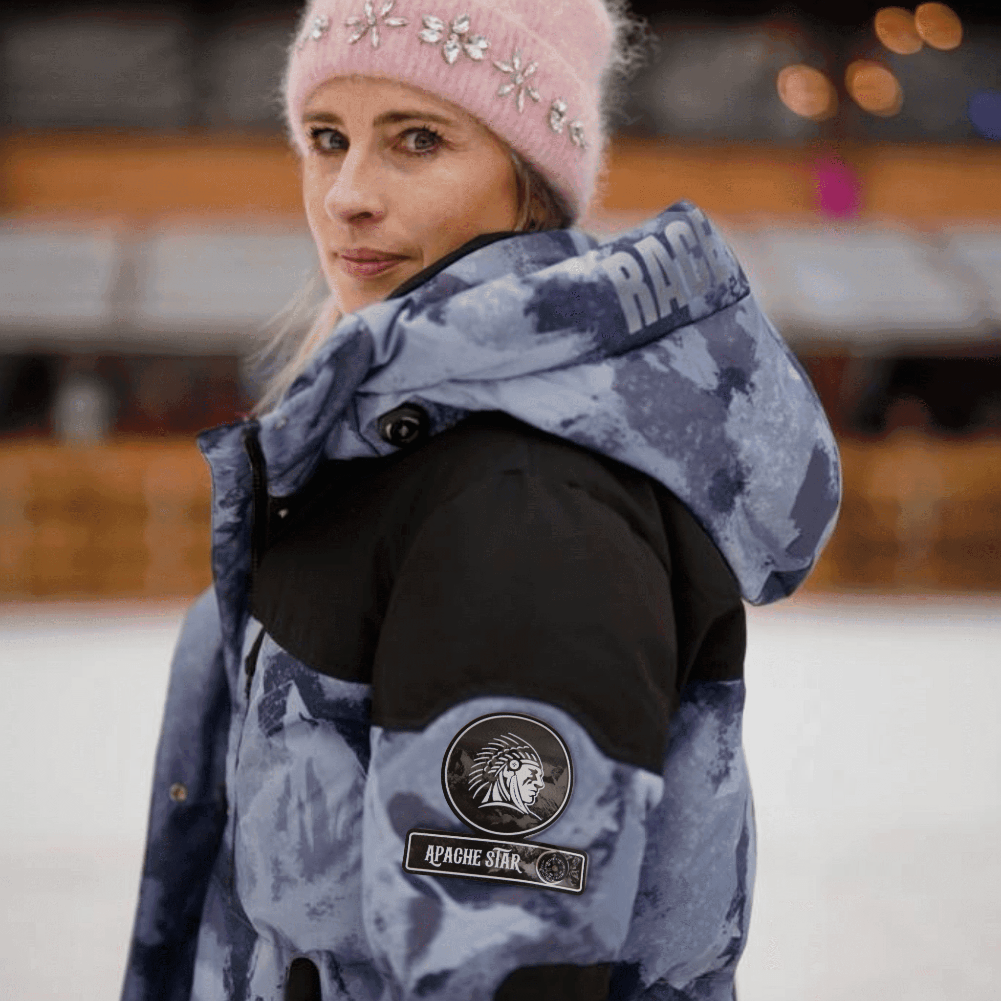 Vintage Down Coat - Blue Camouflage | Function, Style, Tech. Vera Geisel in pink beanie wearing blue camouflage down coat with APACHE STAR patch on sleeve.