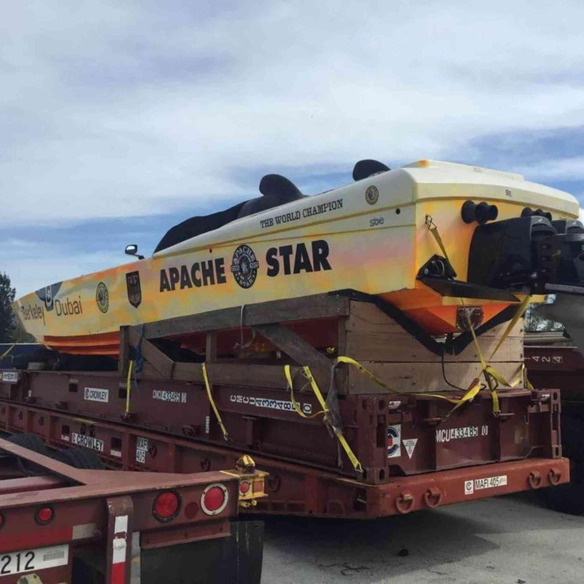 The powerboat APACHE STAR strapped onto a transport trailer